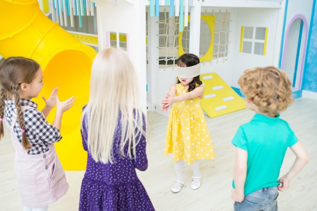 little-girl-playing-tag-blindfolded.jpg